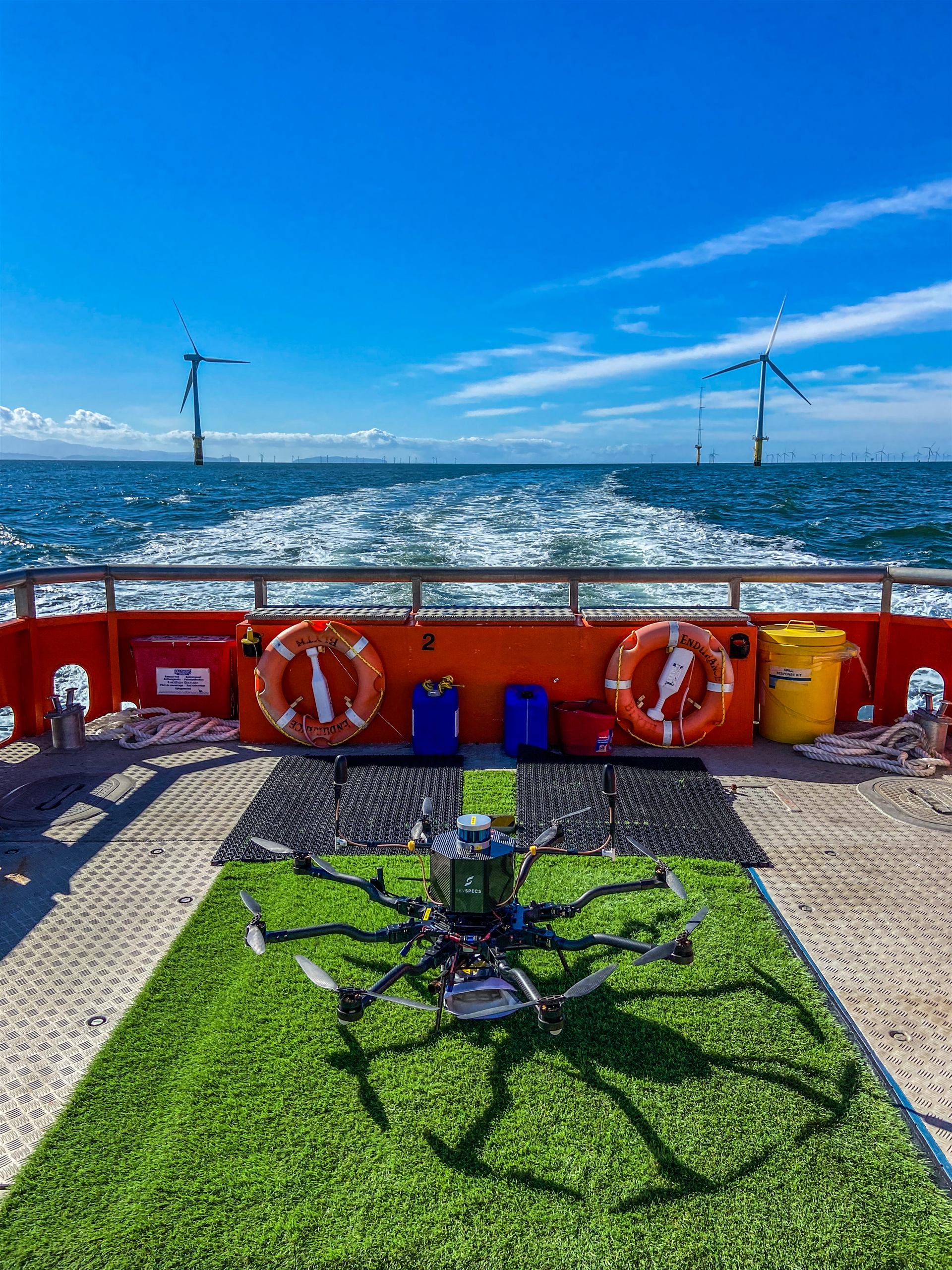 SkySpecs inspection drone on the deck of a crew-transfer vessel, heading out to an offshore wind farm